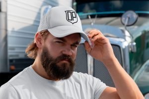 mockup-of-a-bearded-man-with-a-trucker-hat-standing-next-to-a-truck-29488 (2)